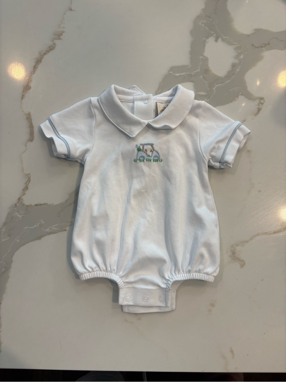 White Baby Polo Romper with Blue Trim and Tractor Embroidery